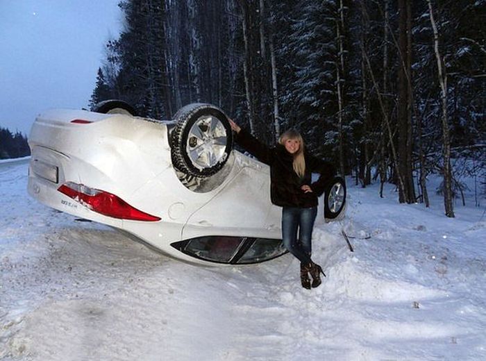 girl-happy-car-upside-down-snow-13587285031.jpg